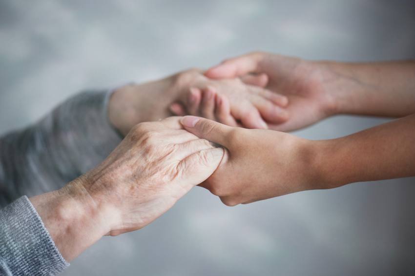 One generation's hands in another's